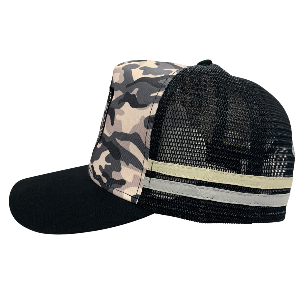 A trucker-style baseball cap with a black curved brim, black mesh back, and a beige, gray, and black camouflage front panel. A beige and white horizontal stripe accents the side of the cap.