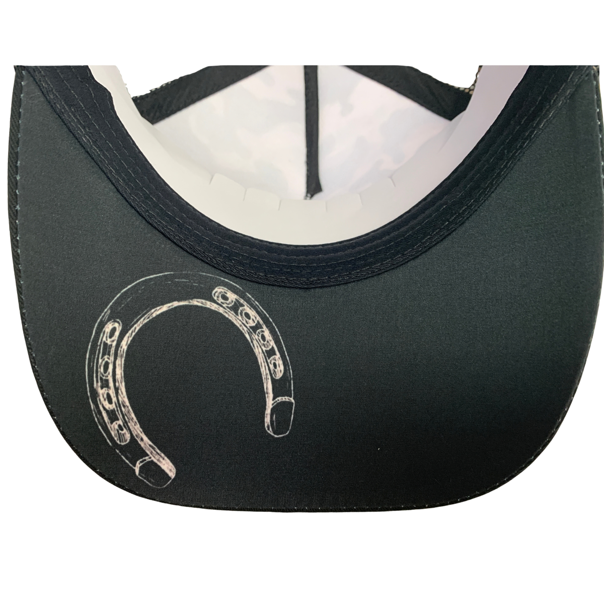 Close-up of the back of a black baseball cap with a white horseshoe graphic printed on the curved back panel.