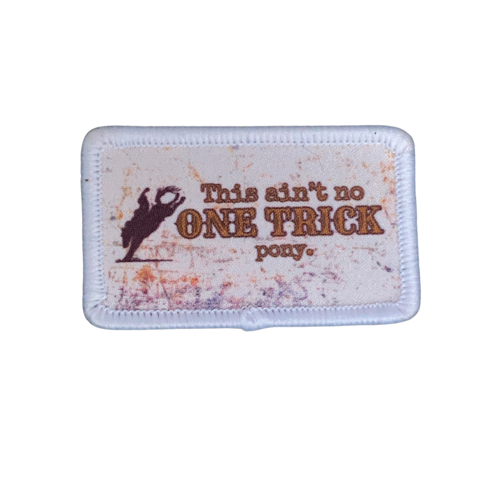 Rocky Mavericks One Trick Pony Hat Patch. Patch with text 'This ain't no ONE TRICK pony' on a white background