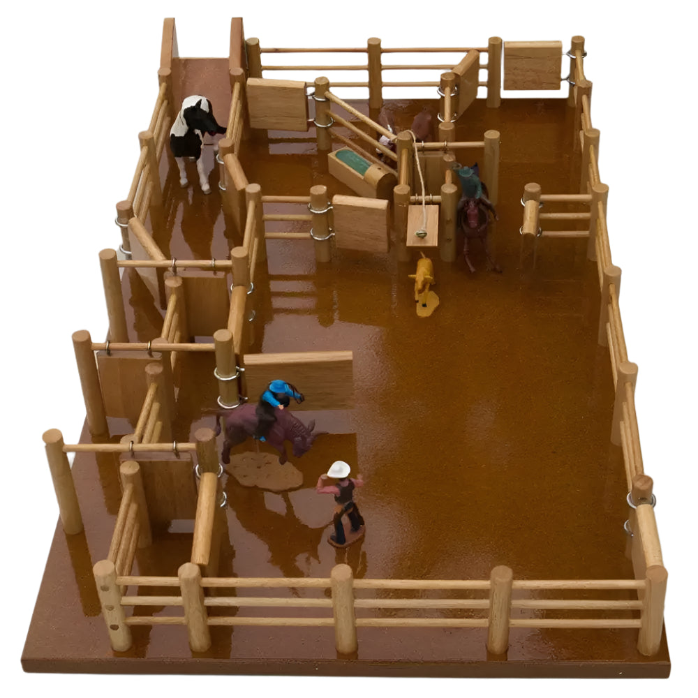 Country Toys RG1 Wooden Rodeo Arena. Wooden rodeo arena toy set with various figures and chutes, resembling a miniature version of a real rodeo ground.