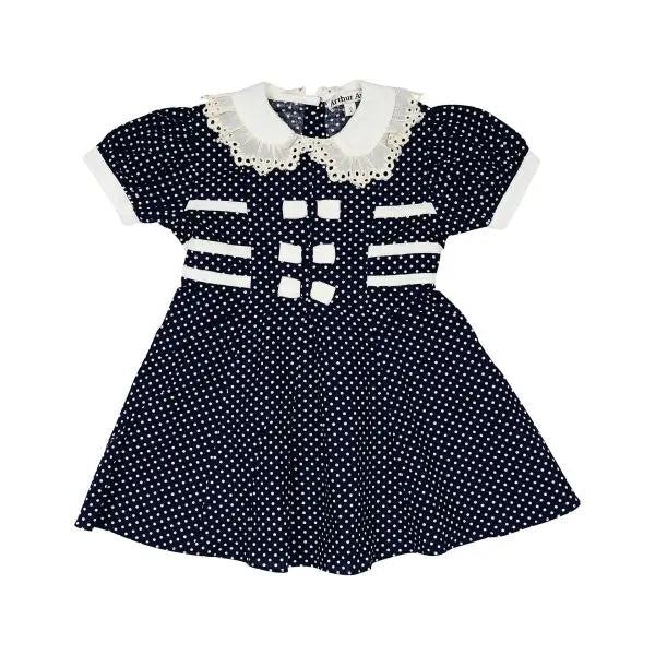 Arthur Ave girl&#39;s navy polka dot dress with white trim on a white background