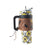 Wide Wyoming Tumbler In Yellow with Tooling. Tumbler with floral design and brown leather sleeve on a white background