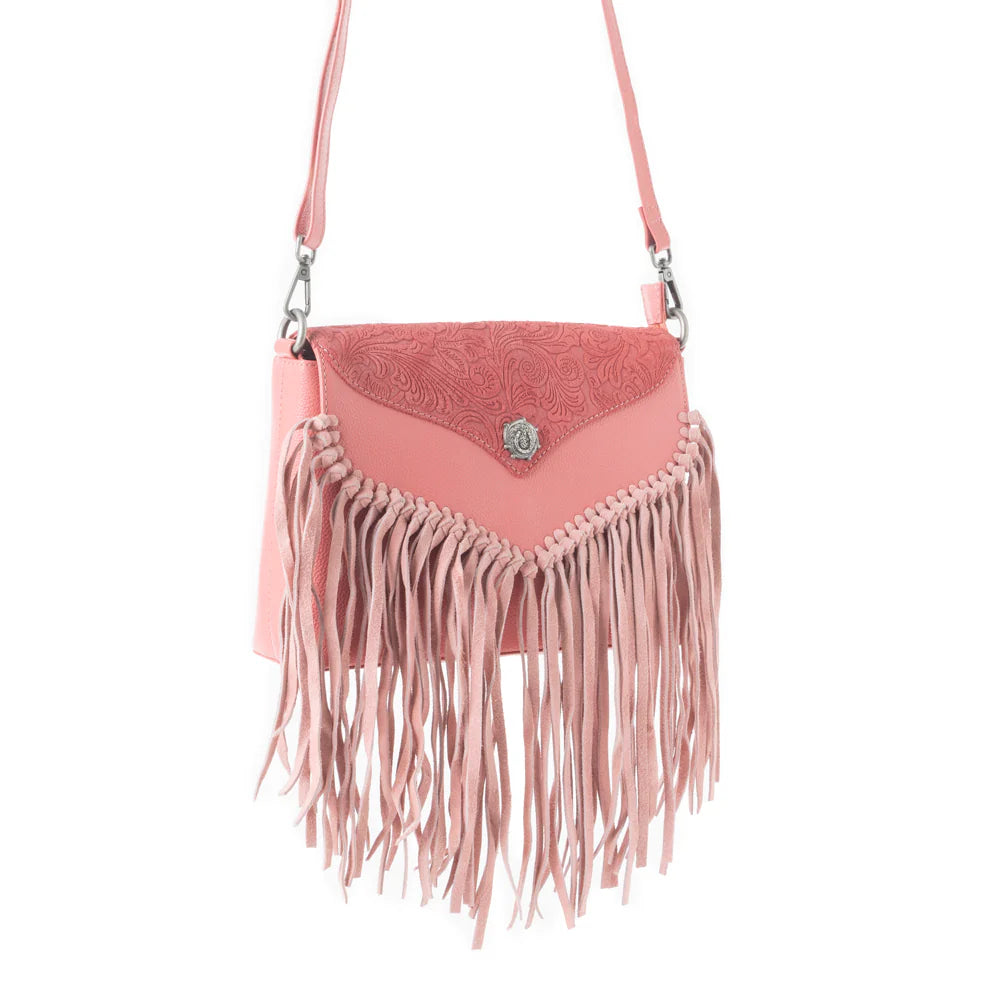 Wild West Fringe Leather Crossbody Bag in Pink. Pink fringed handbag with a white background