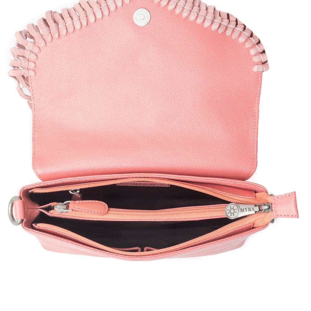 Wild West Fringe Leather Crossbody Bag in Pink. Pink handbag with a zipper on a white background
