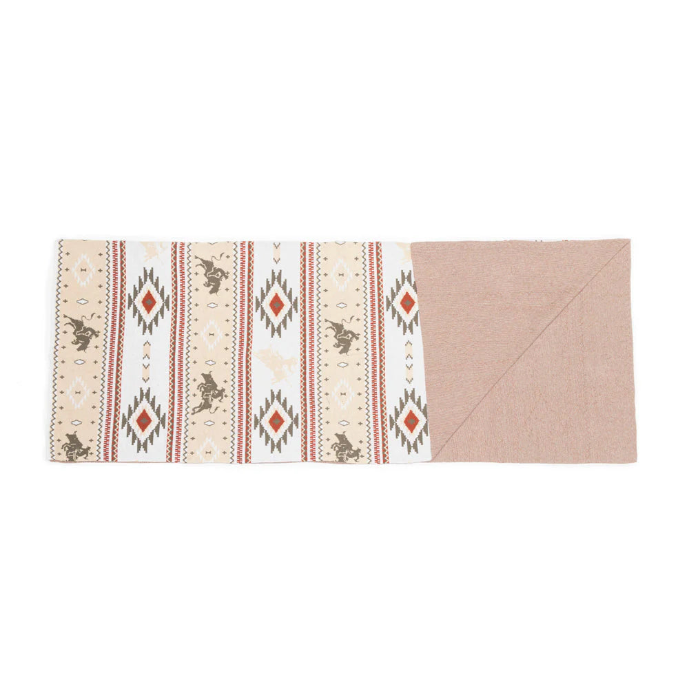 Starstone Throw. Folded fabric with geometric pattern on a white background