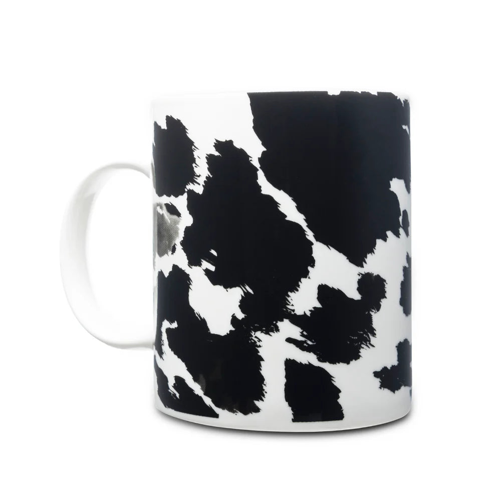 Sippin’ in the South Ceramic Mug in Black Leopard Print. Mug with black and white abstract pattern on a white background
