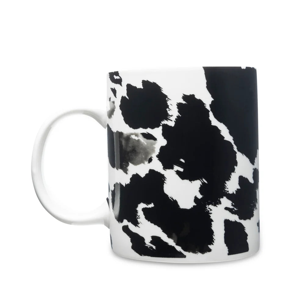 Sippin’ in the South Ceramic Mug in Black Leopard Print. Mug with black and white abstract pattern on a white background