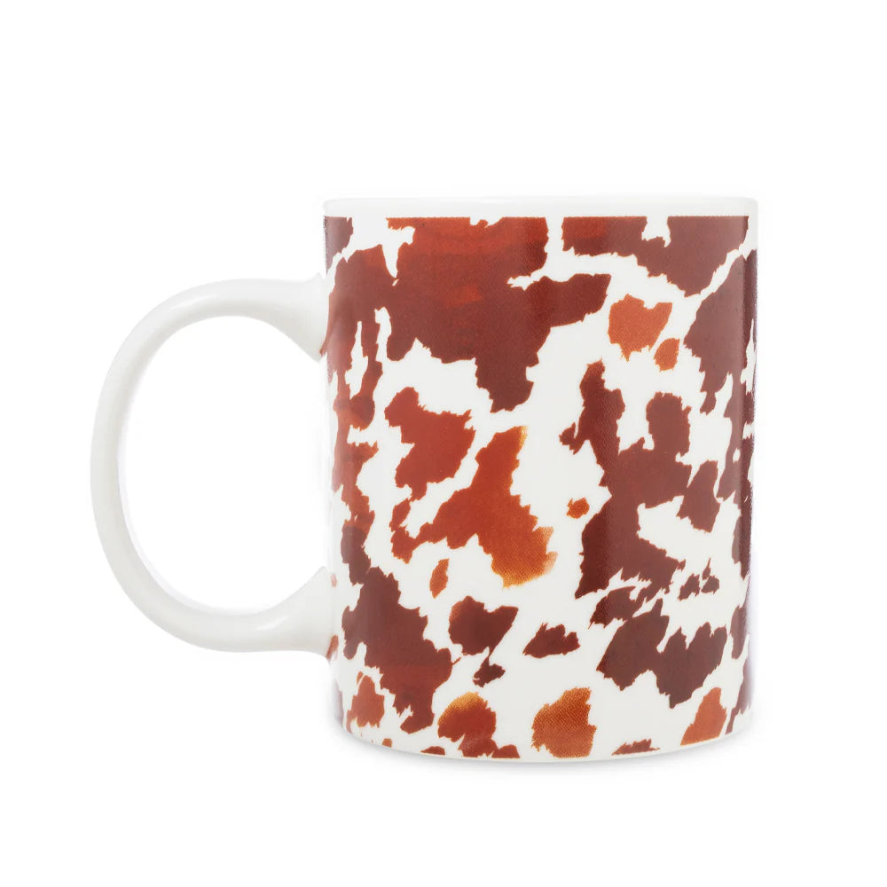 Sippin’ in the South Ceramic Mug in Brown Leapard PrintMug with cow print pattern on a white background 