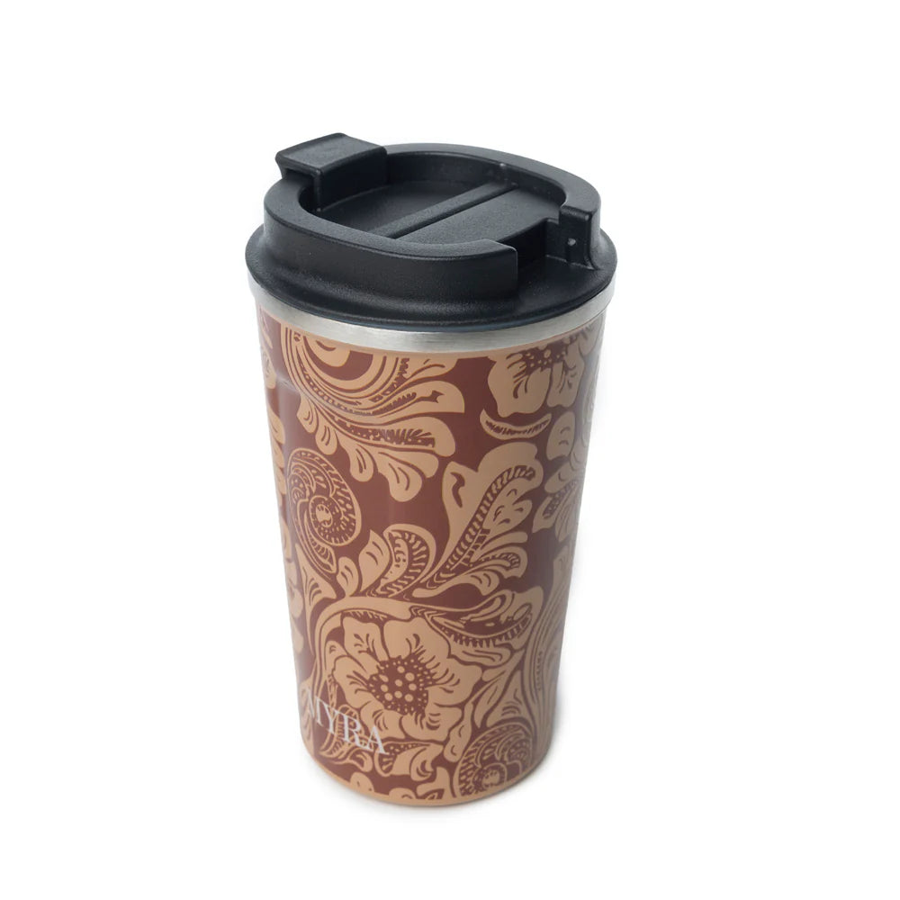 Western Trail Brew Stainless Steel Mug in Brown Baroque. Travel mug with brown floral pattern and black lid on a white background