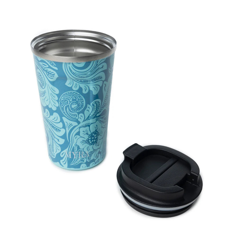 Western Trail Brew Stainless Steel Mug in Turquoise. Blue patterned tumbler with a black lid on a white background
