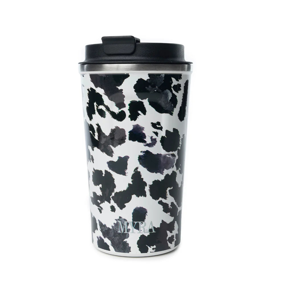 Western Trail Brew Stainless Steel Mug in Black Leopard Print. Travel mug with black and white cow print pattern on a white background