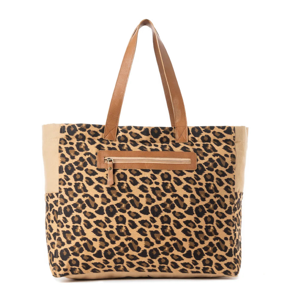 Panthera Cowgirl Weekender Bag in Jaguar Print. Leopard print tote bag with brown leather handle and zipper on a white background