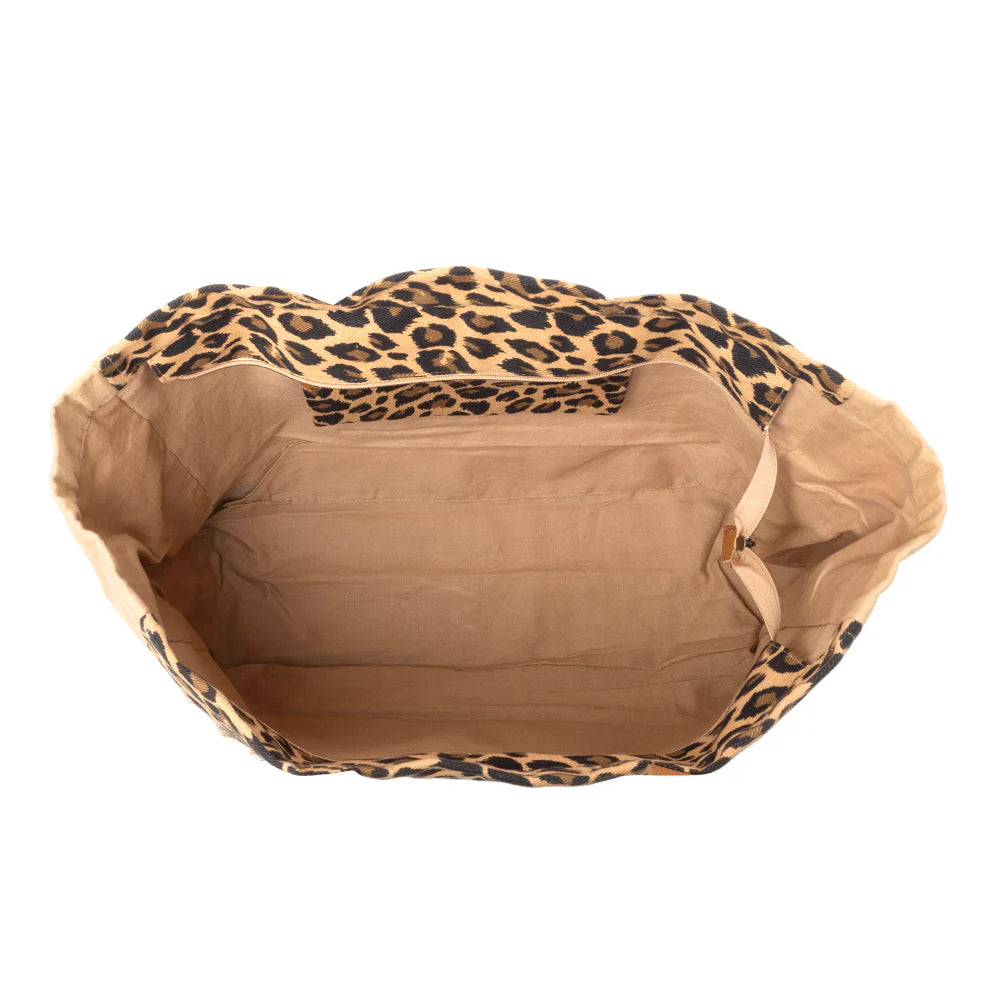 Panthera Cowgirl Weekender Bag in Jaguar Print. Pet bed with leopard print top and brown interior on a white background