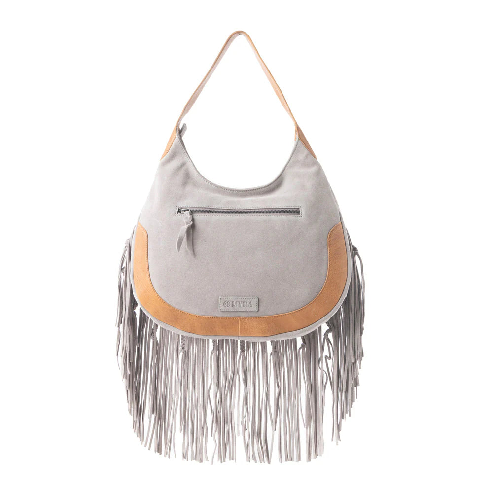 Sage Whisper Fringe Leather Bag in Pearl White. Gray handbag with brown fringe and trim on a white background