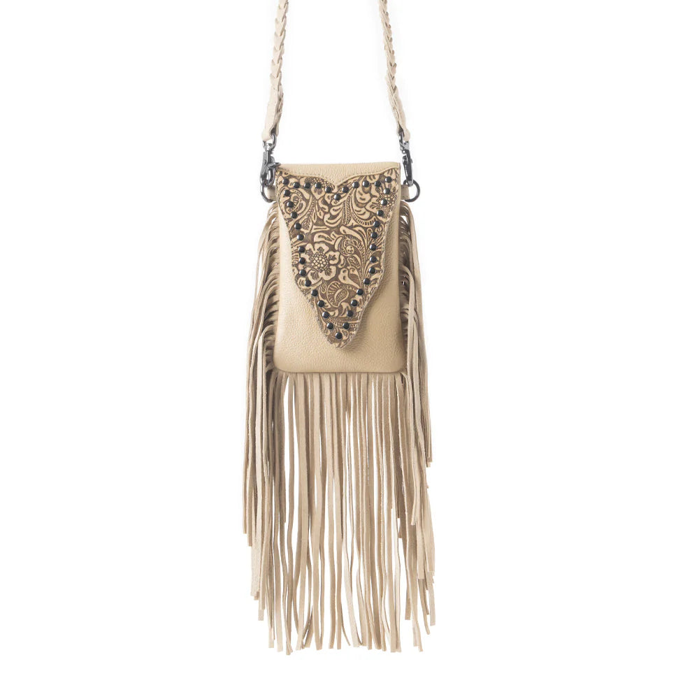 Whispering Totem Leather Western Handbag in Nomad Ivory. Beige handbag with fringe and intricate design on a white background