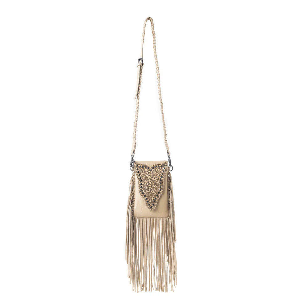 Whispering Totem Leather Western Handbag in Nomad Ivory. Beige handbag with fringe and embellishments on a white background