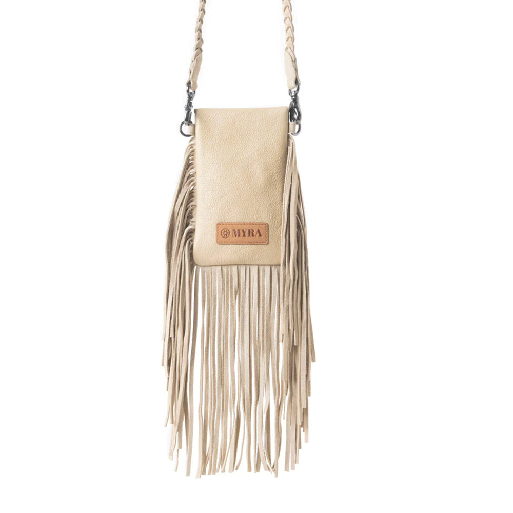 Whispering Totem Leather Western Handbag in Nomad Ivory. Beige handbag with fringe and decorative element on a white background