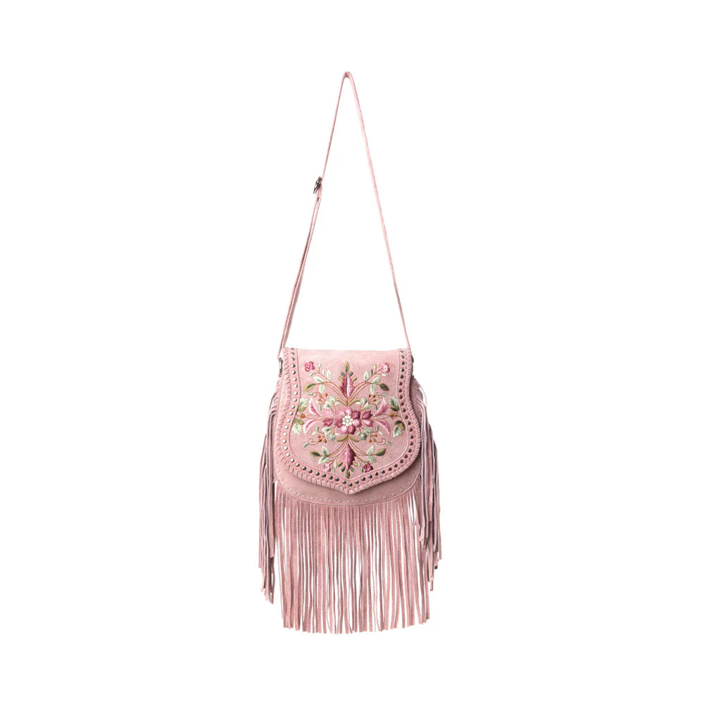 Pink handbag with floral embroidery and fringe on a white background