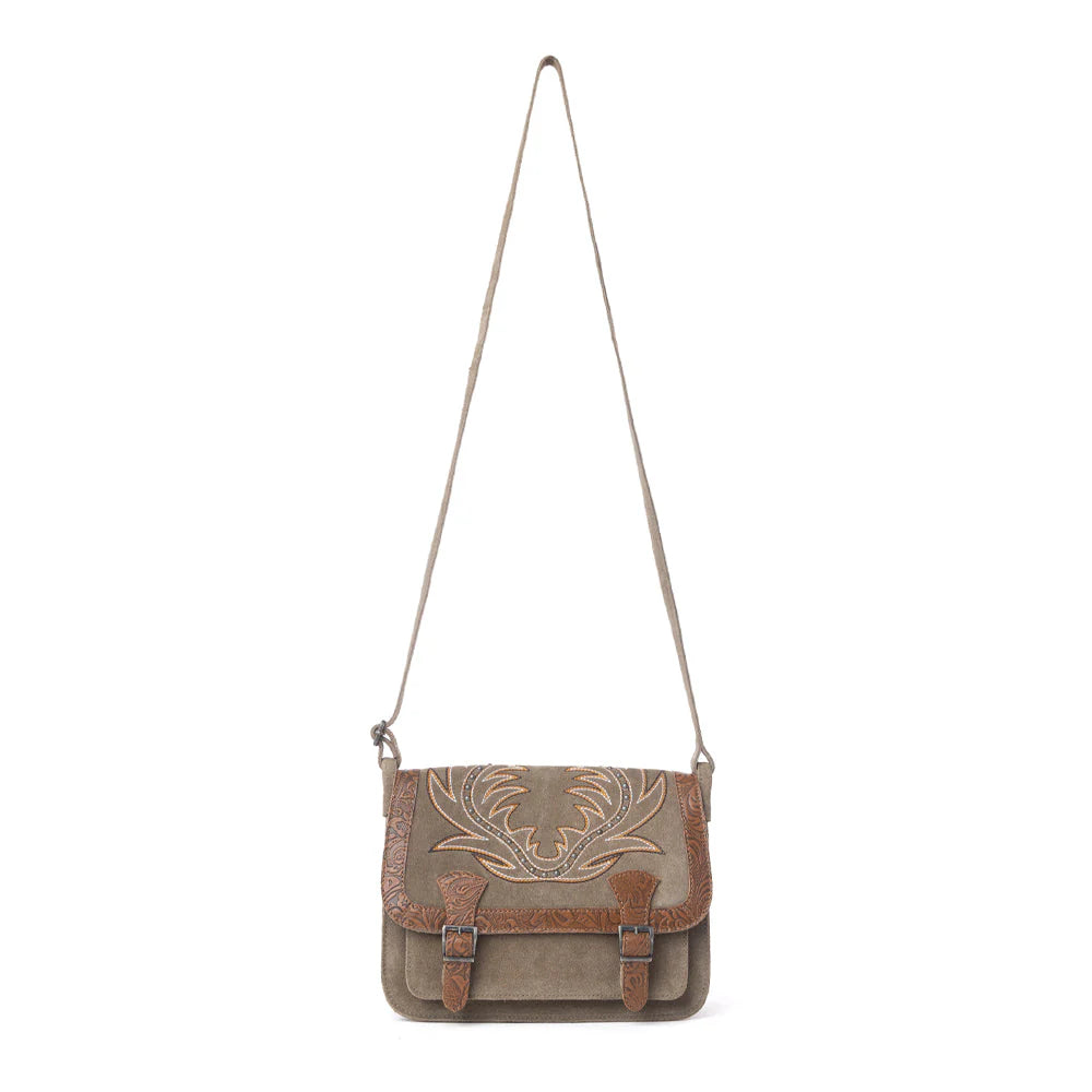 Canvas crossbody bag with embroidered design on a white background