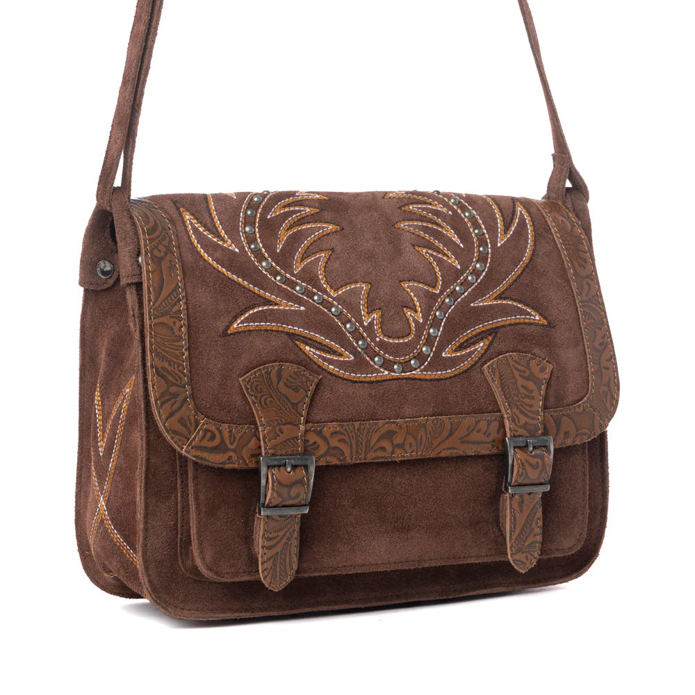 Brown leather handbag with intricate embossing and decorative elements on a white background