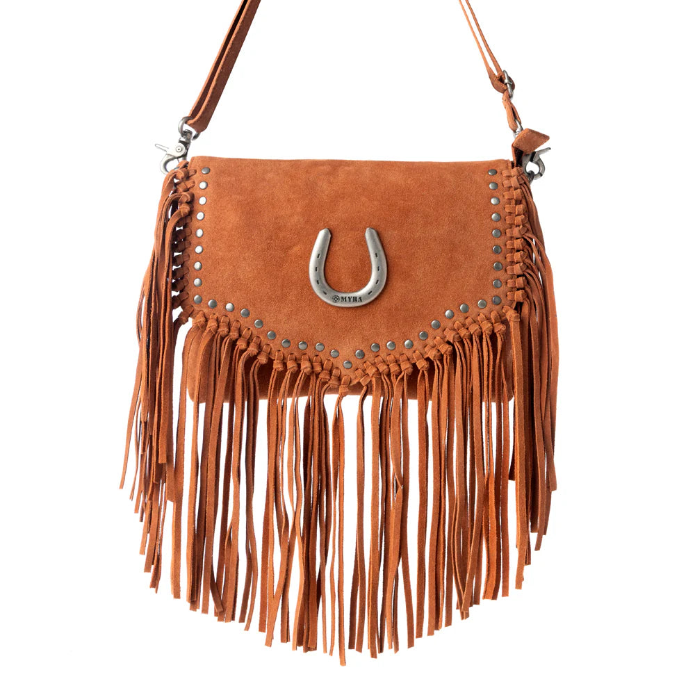 Brown suede handbag with fringe and a horseshoe charm on a white background