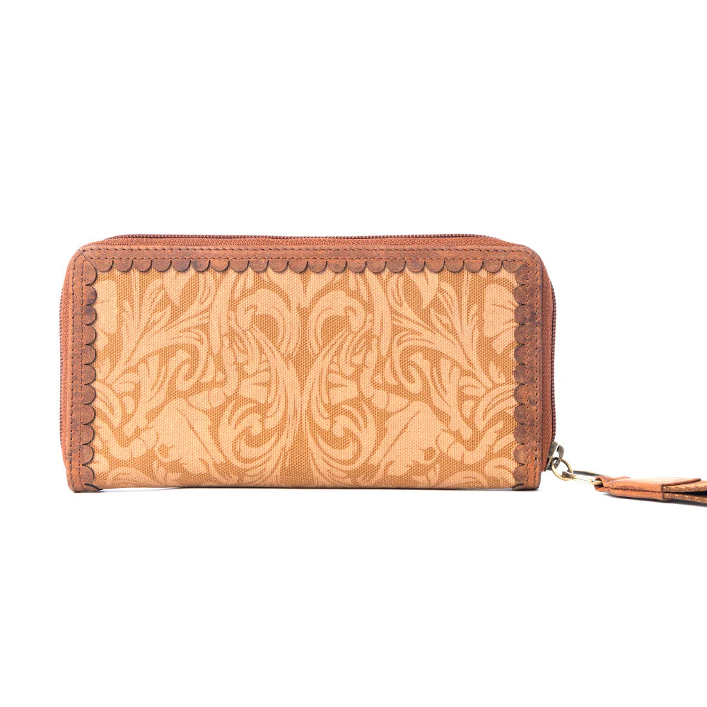 Yellowstone Montana Amber Wallet. Brown leather wallet with intricate pattern on a white background