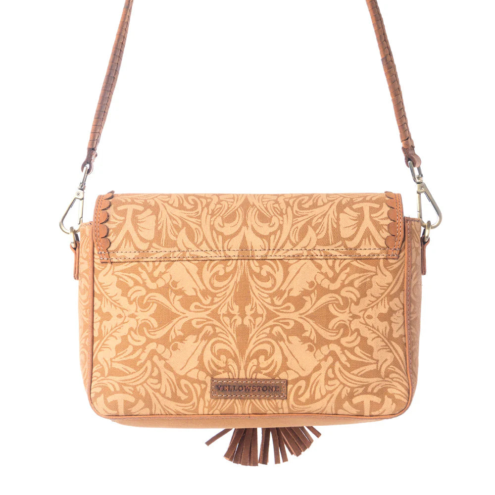 Yellowstone Sierra Amber Tassle Crossbody Bag. Tan patterned crossbody bag with a visible brand logo on a white background
