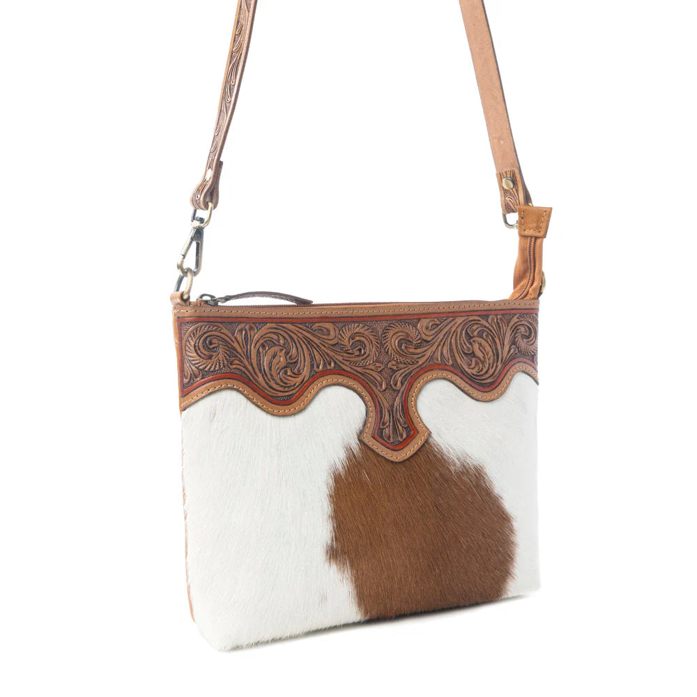 Sienna Grace Handtooled Hairon Leather Bag in Western Copper. Cowhide crossbody bag with decorative brown leather trim on a white background