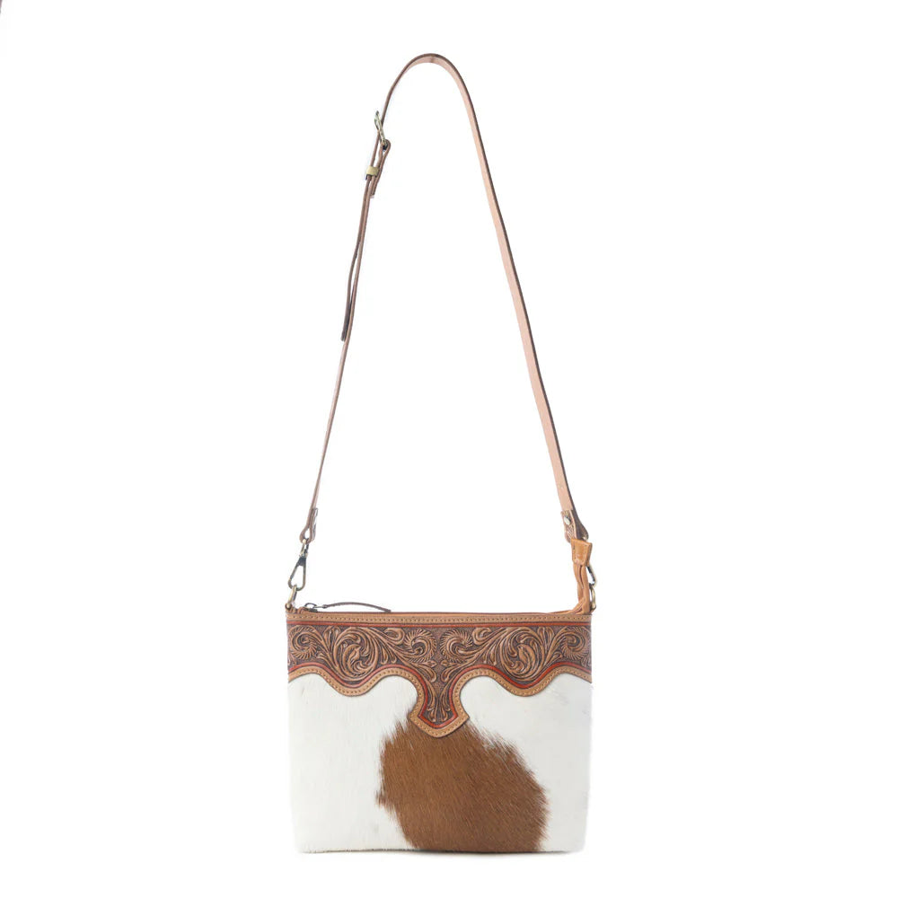 Sienna Grace Handtooled Hairon Leather Bag in Western Copper. Handbag with cowhide pattern and brown leather accents on a white background