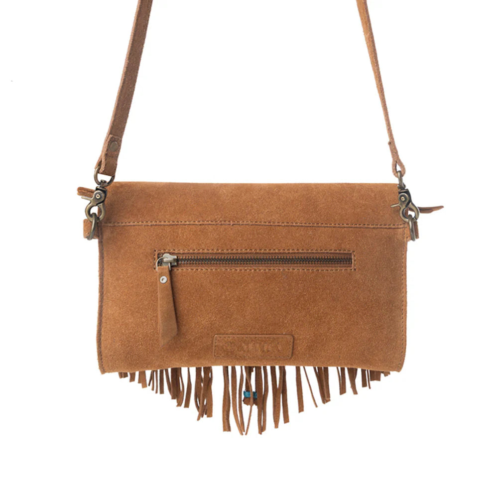 Brown suede handbag with fringe details on a white background