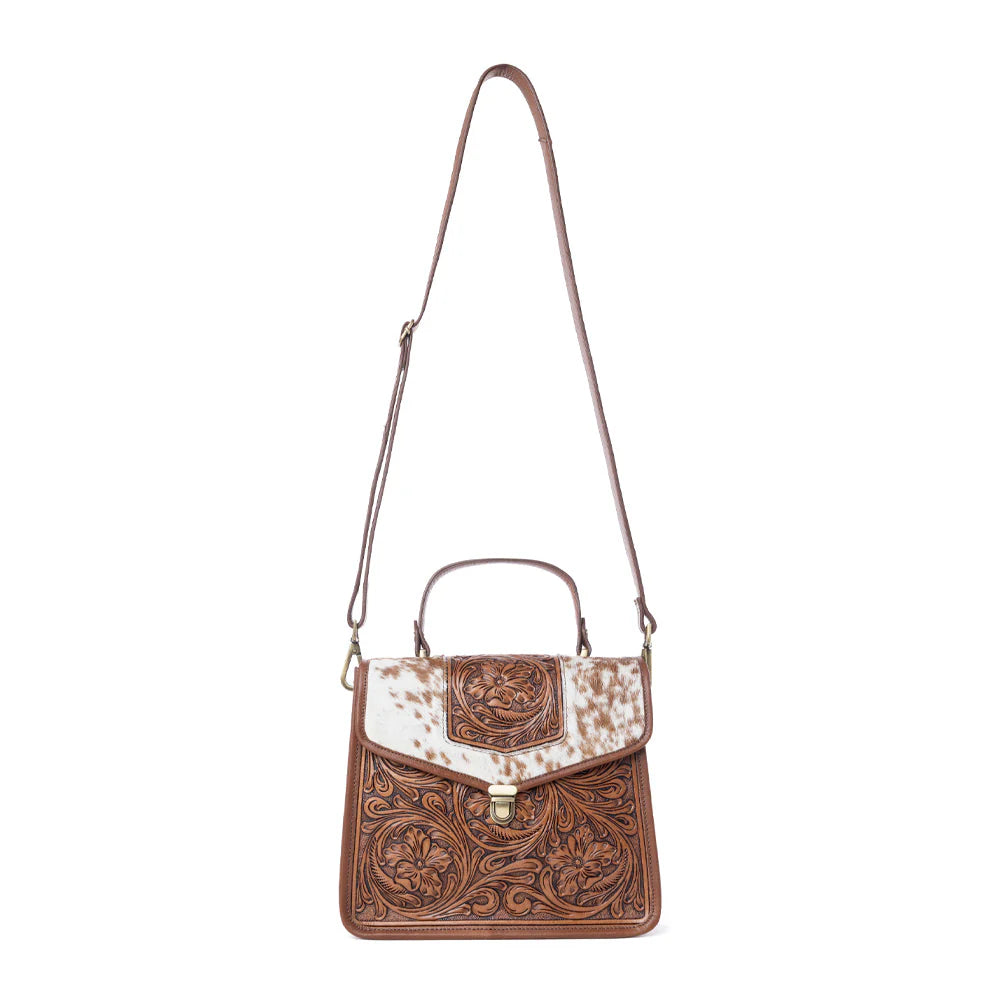 Brown leather handbag with white pattern on a white background