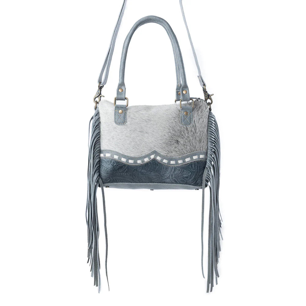 Gray handbag with fringe details on a white background