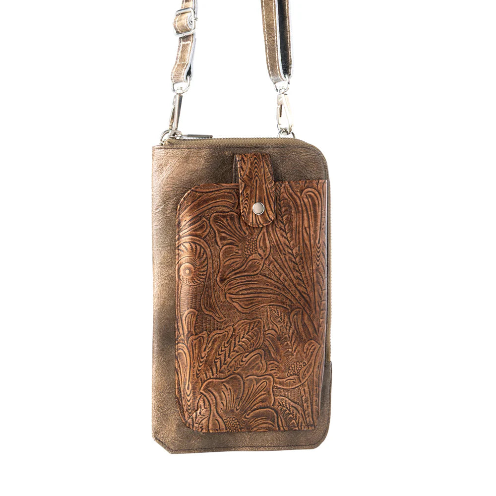 Brown leather crossbody bag with intricate patterns on a white background