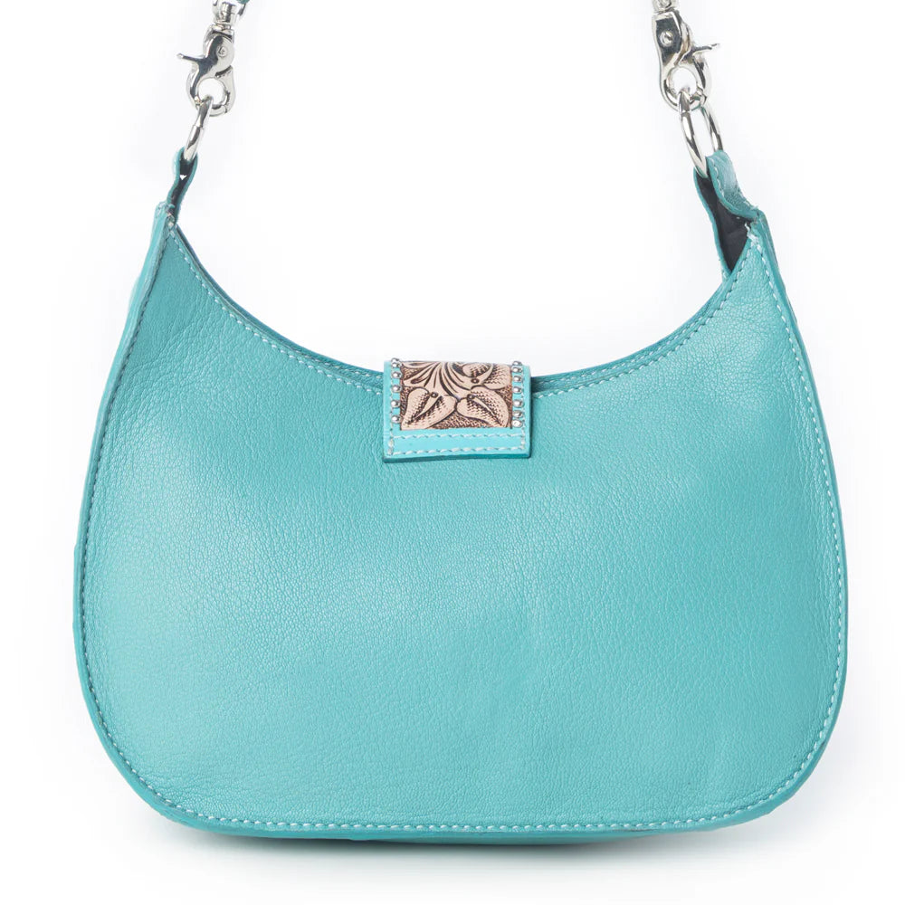 Light blue handbag with a decorative clasp on a white background