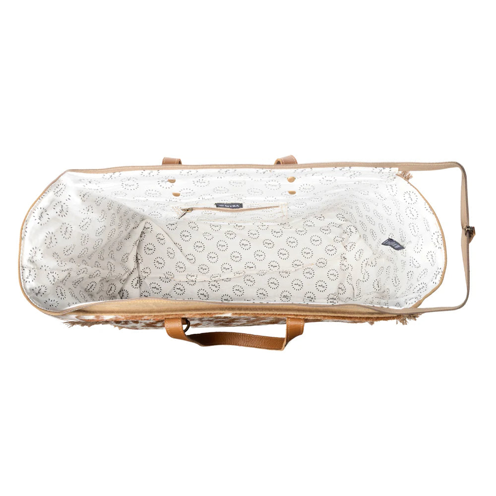 White patterned bag with beige straps on a white background