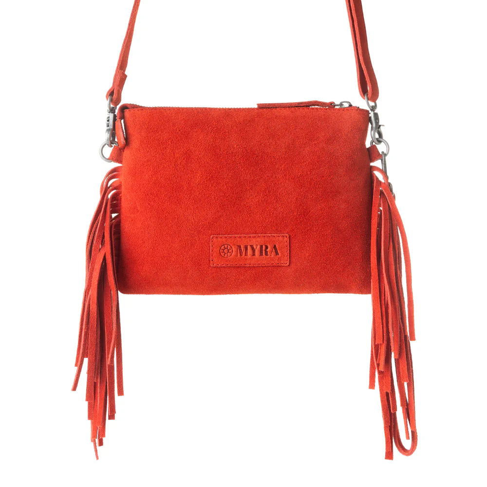 Red suede handbag with fringes and 'MYRA' brand logo on a white background