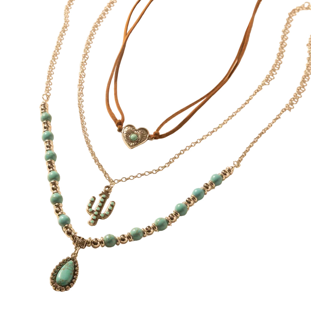 Three necklaces with turquoise beads and heart pendants on a beige background