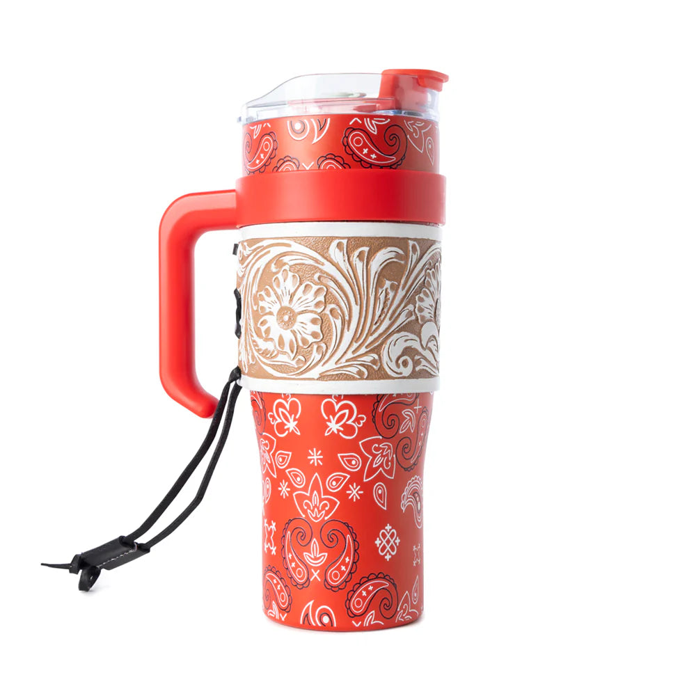 Red and beige patterned travel mug with handle on a white background