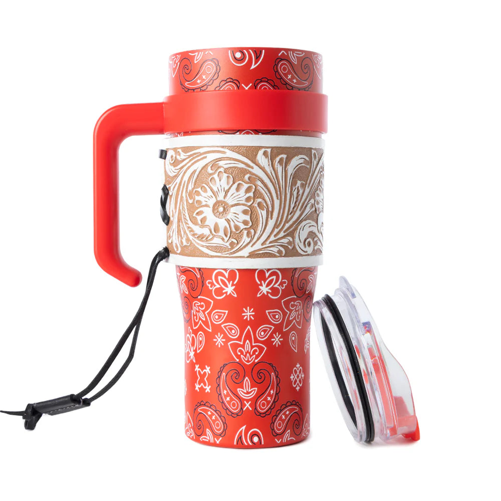 Red and white patterned travel mug with handle on a white background