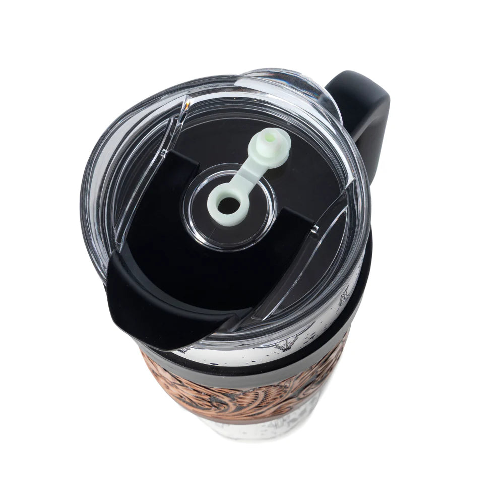 Clear tumbler with black lid and handle on a white background
