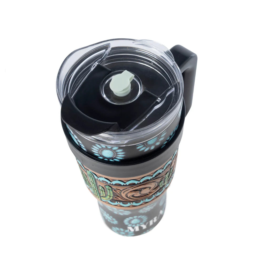 Travel mug with a black lid and colorful design on a white background