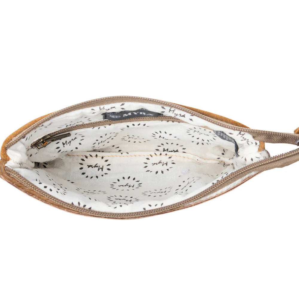 Open beige handbag with white interior featuring black patterns on a white background