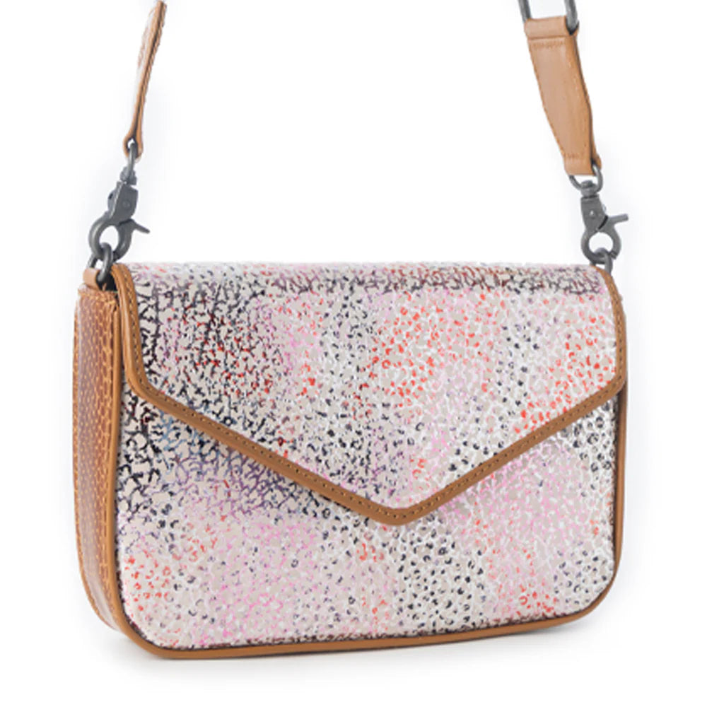 Multicolored patterned handbag with brown leather accents on a white background