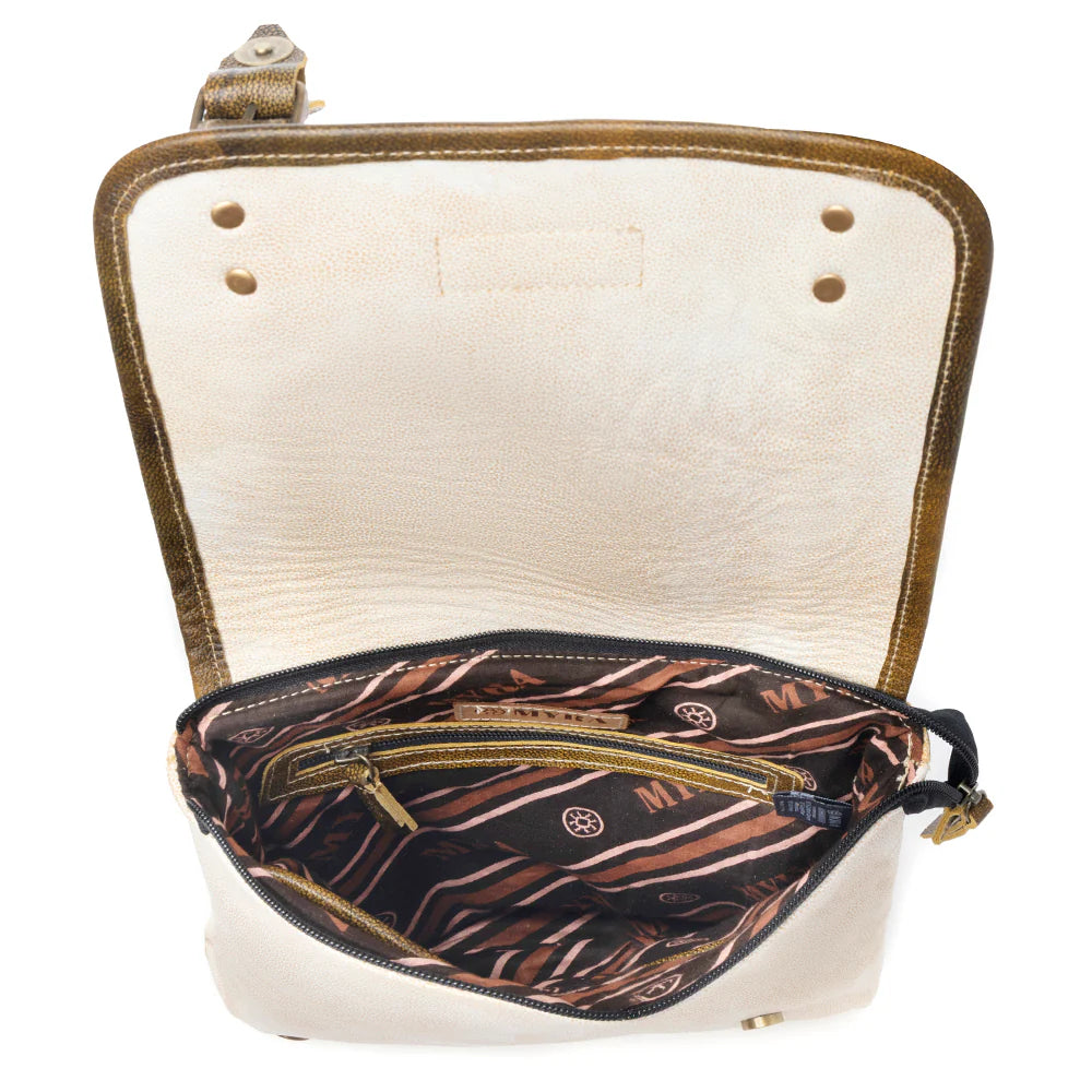 Open beige leather bag with zebra pattern interior on a white background