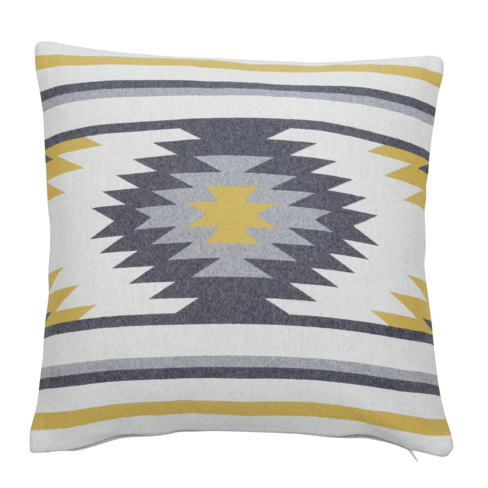 Vibrant Aztec Cushion Cover. Decorative pillow with geometric pattern on a white background