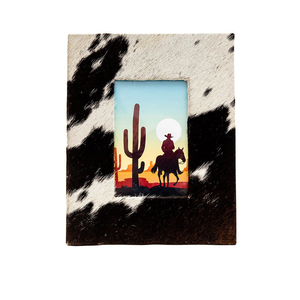 Cactos Photo Frame. A photo frame with a black and white hairon texture and a picture of a cactus and a cowboy in the frame