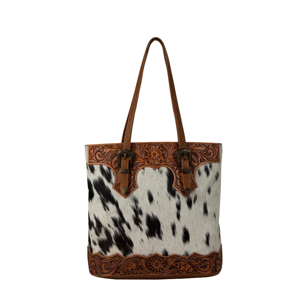 Women's Rio Hand-Tooled Bag. A hand-tooled leather bag with a hair-on hide pattern on the front and deep caramel leather on the reverse, featuring a zippered pocket and carrying handles.