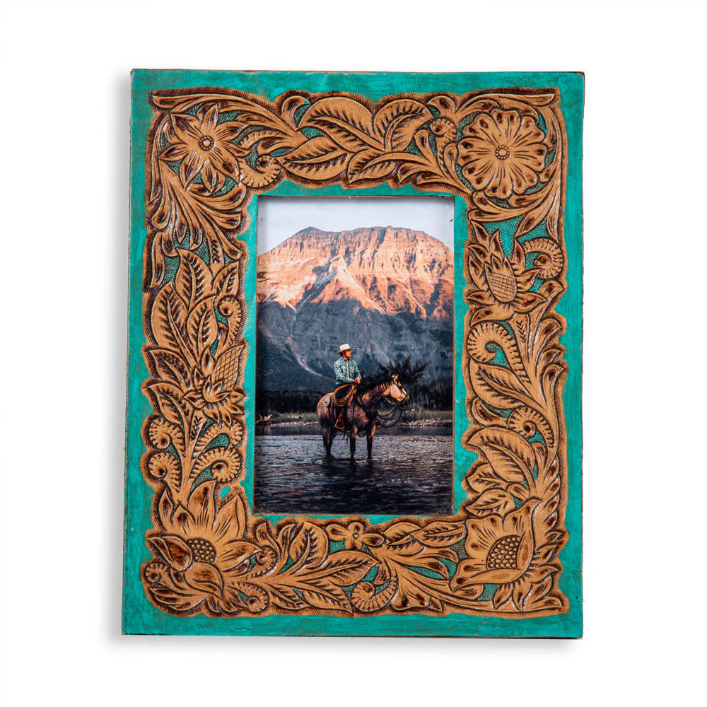 Time of Traditions Hand-Tooled Photo Frame. Decorative photo frame with a mountain and horse and rider photo.
