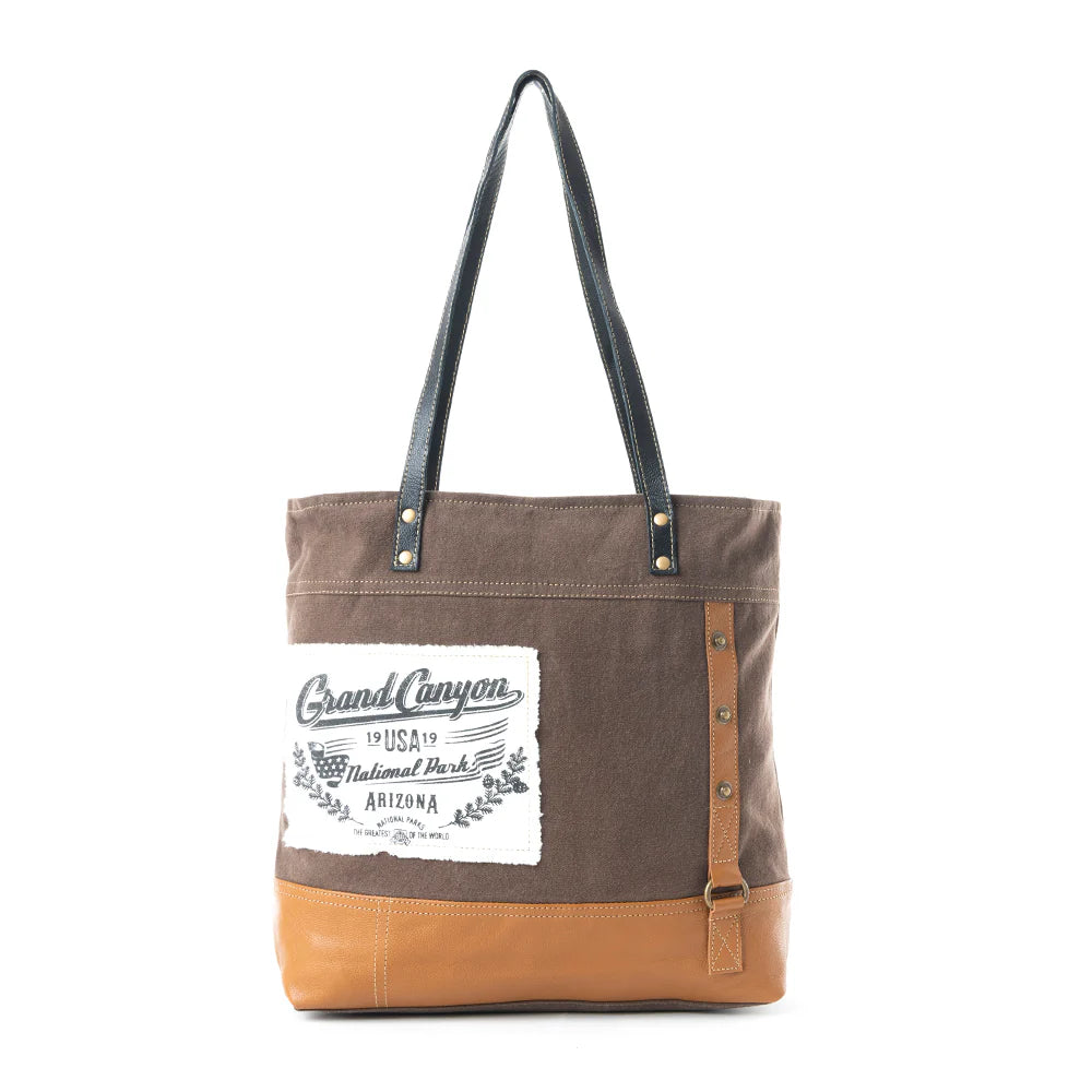 Brown and tan tote bag with 'Grand Canyon National Park' label on a white background