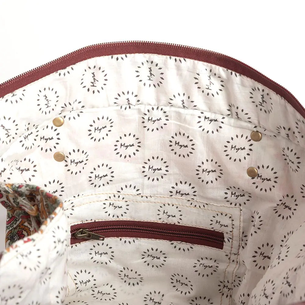 Women's Paisley Pointe Weekender Bag. A paisley patterned weekender bag with brown leather straps and details.